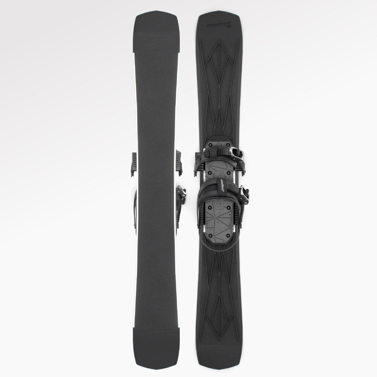 Skiblades Pair of black skis with snowboard bindings on a white background
