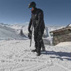 Skiblades Man using Snowfeet Skiblades 100, putting them on and skiing down the slope